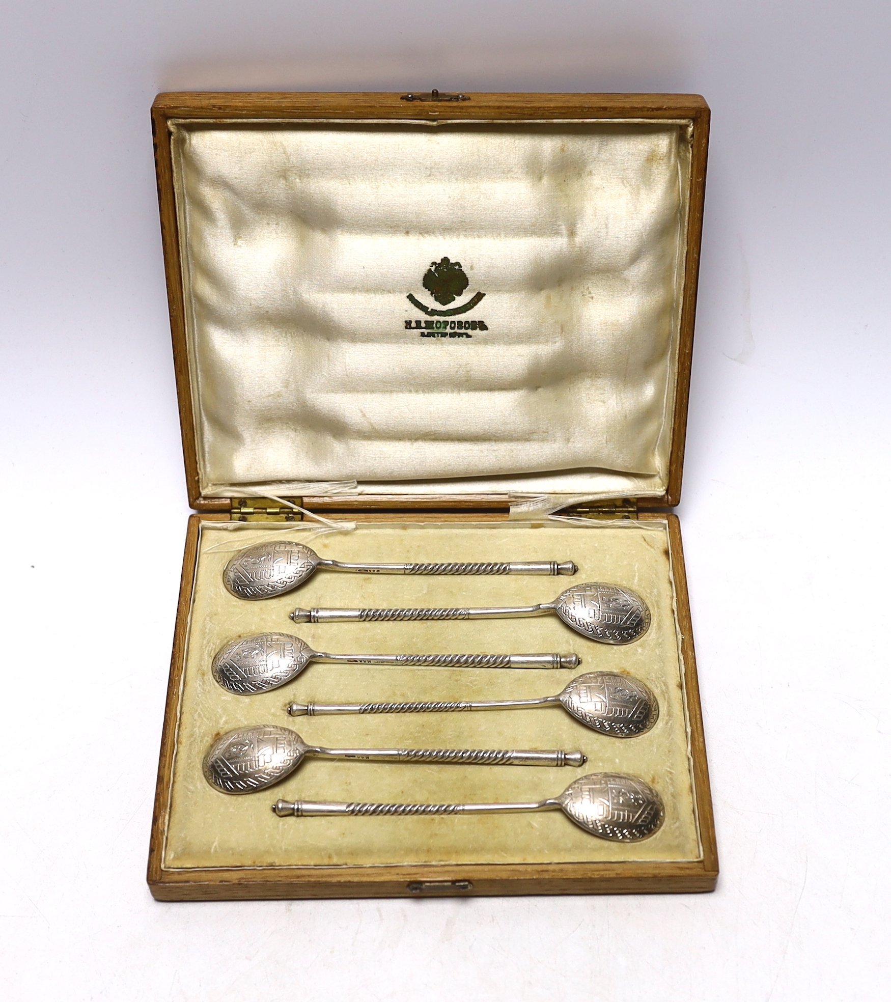 A cased set of six late 19th/early 20th century Russian 84 zolotnik teaspoons with engraved bowls, master, Matryena Andreyevna? 12.8cm.